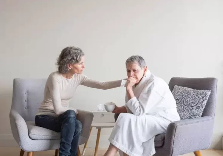 Woman Helping Senior With Anxiety 768x556