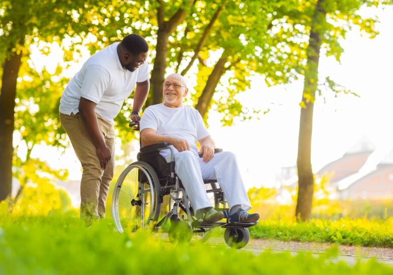 Caregiver,and,old,man,in,a,wheelchair.,professional,nurse,and